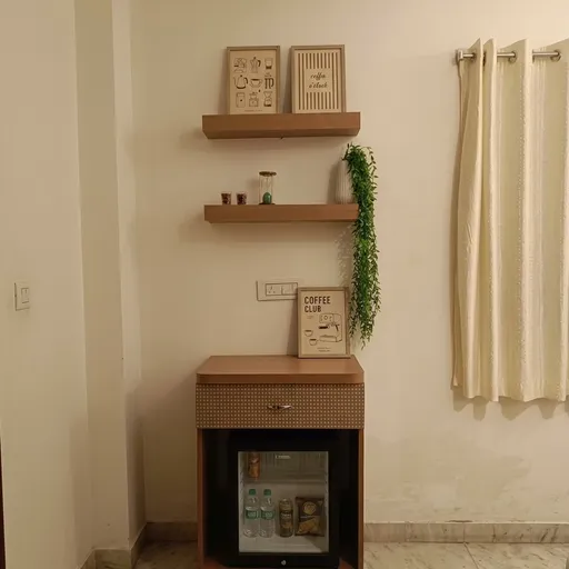 Coffee corner with floating shelves and a mini-fridge